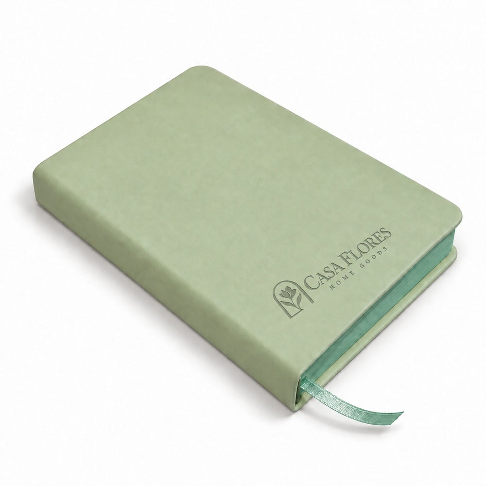 Casa Flores reading journal beside an open book