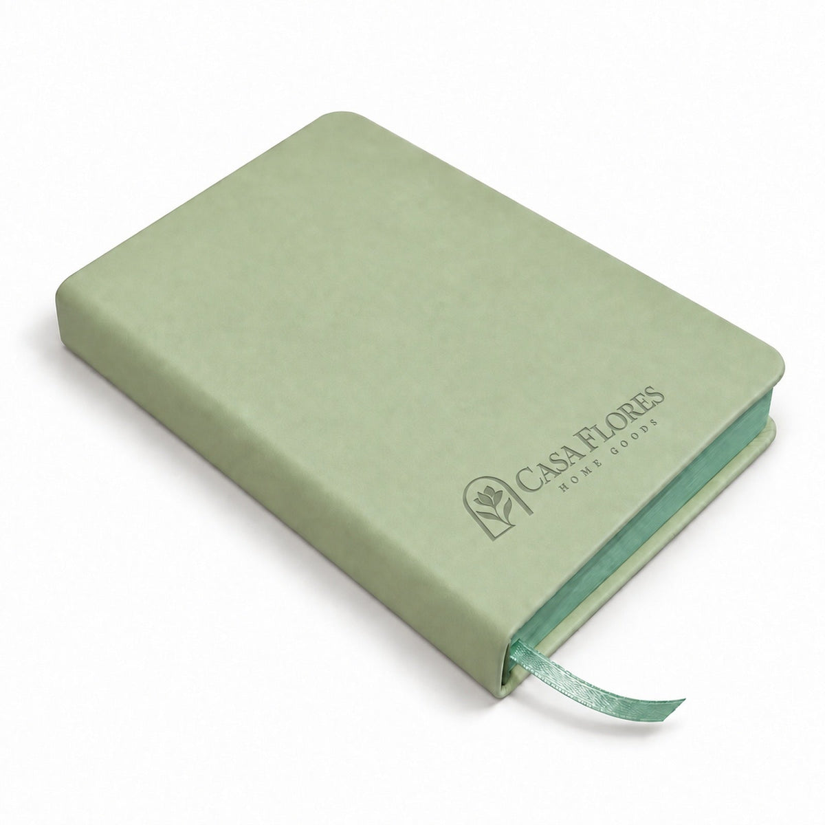 Casa Flores reading journal beside an open book